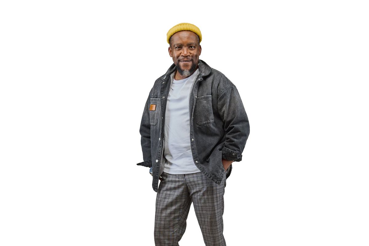 A photo of actor Jimmy Gathu smiling confidently at the camera.