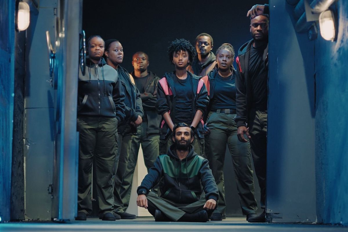 A still photo of the cast of ‘Subterranea’ looking into the camera.