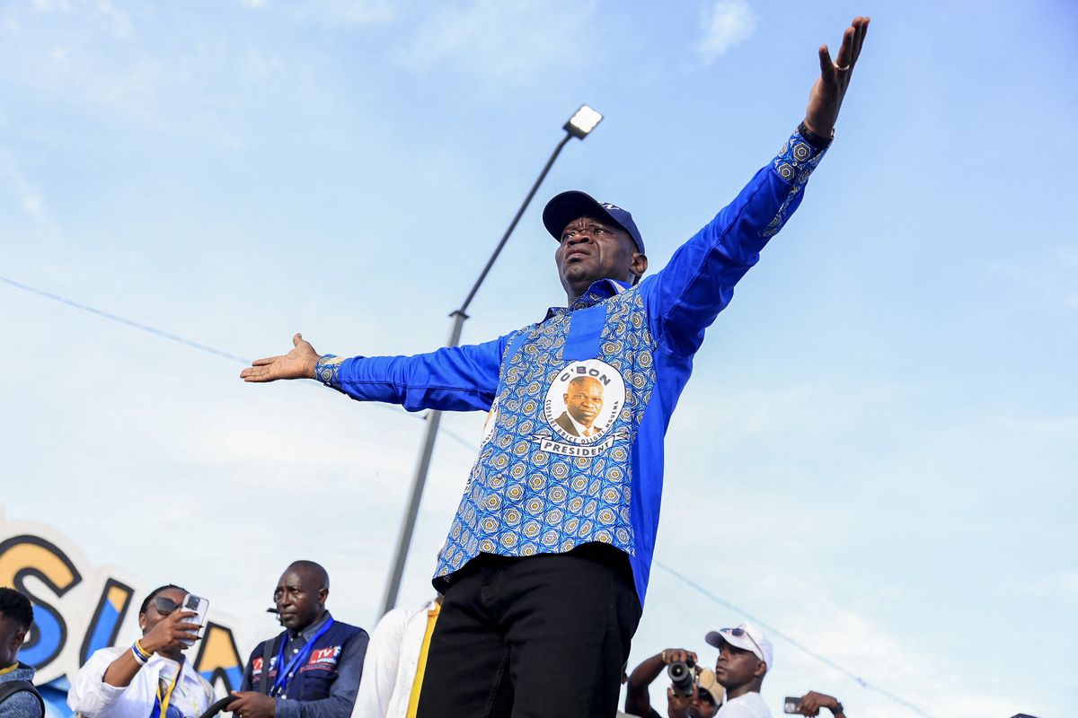 Brice Oligui Nguema on stage with outstretched hands  during his last electoral campaign.