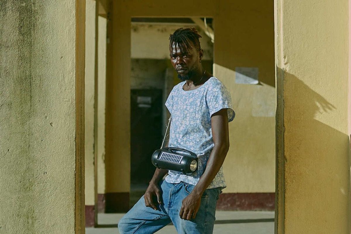 Kengol DJ from cameroon stands and poses