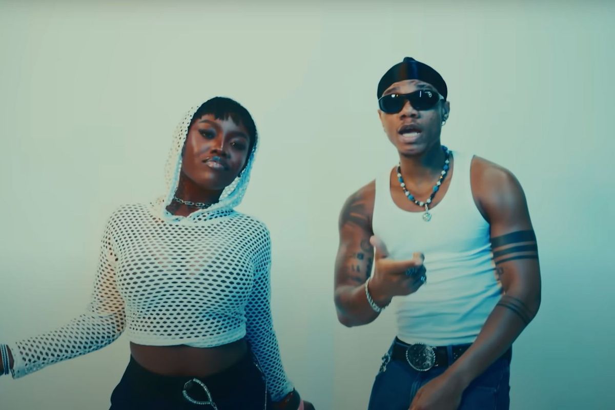 KiDi and Gyakie in the music video for “Cheat On You.”