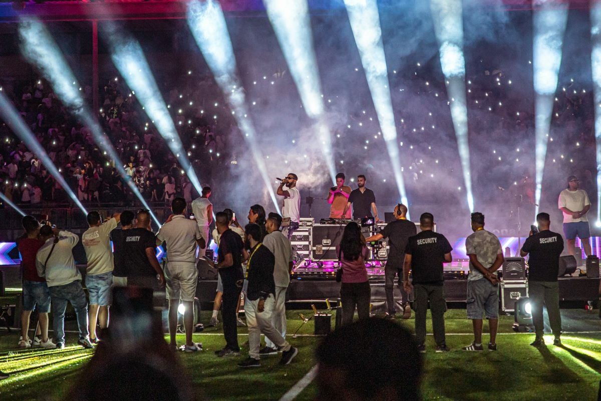Musicians performing on stage at Benghazi Summer Festival to a big crowd. 