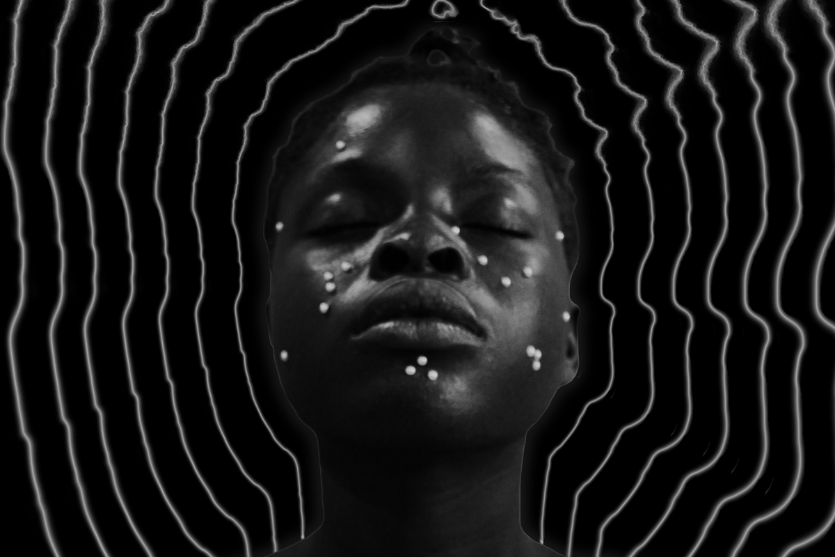 A black and white artistic portrait of a person with dark skin, eyes closed, and adorned with small white facial markings. White lines ripple around the person's head to make frequency-like waves around the person's head, creating a halo-like effect against the dark background.