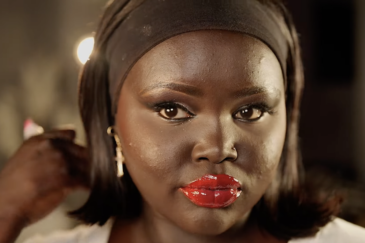 A still from Nyadollie’s makeup tutorial video on YouTube.