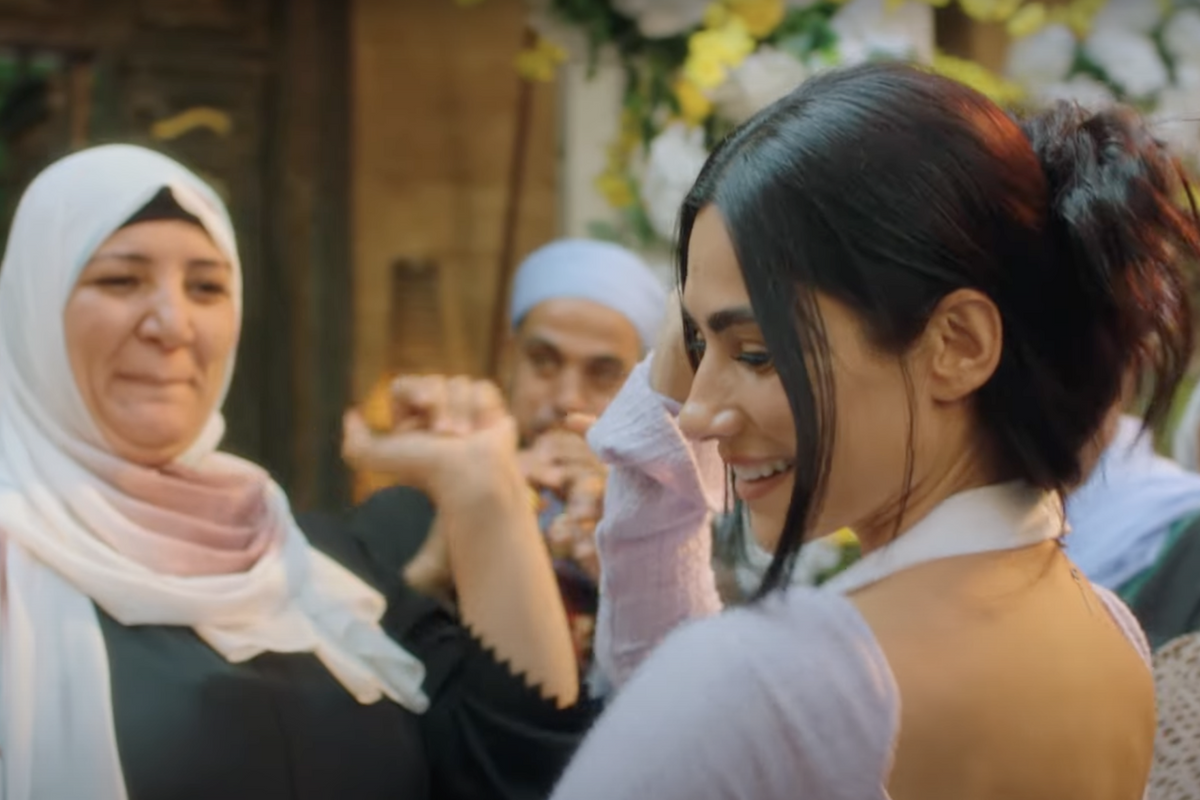 Huda El Mufti starring as Didi in Mat’am El Habayeb, dancing amidst a group of elderly women.  
