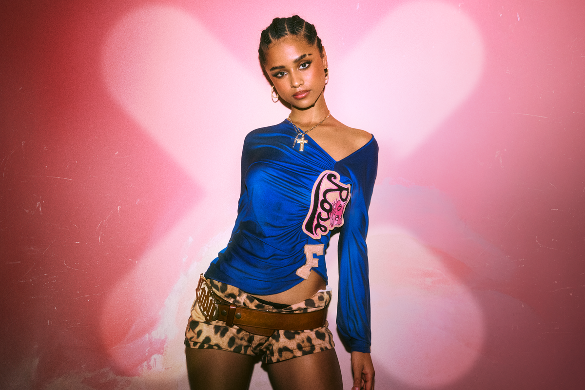 South African star Tyla poses in front of a pink background ahead of her concert in South Africa. 